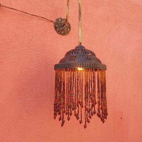 Wall light with beaded fringe