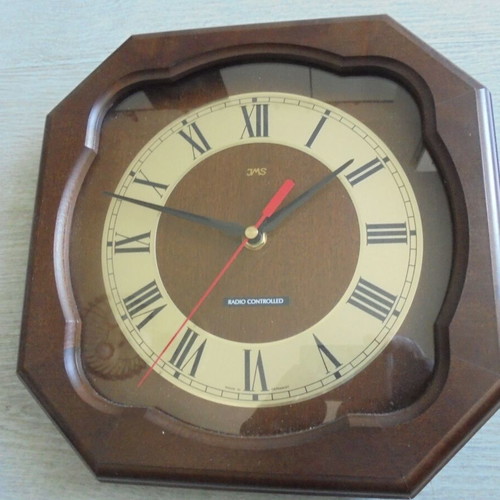 Wall clock radio controlled used with wooden frame and Roman numerals