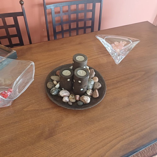 Decorative table set with stones and candles, new
