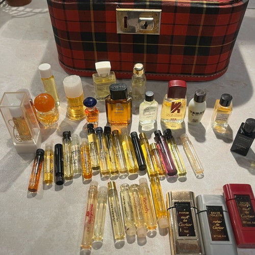 Filled vintage women's perfume vials from 1960-1990