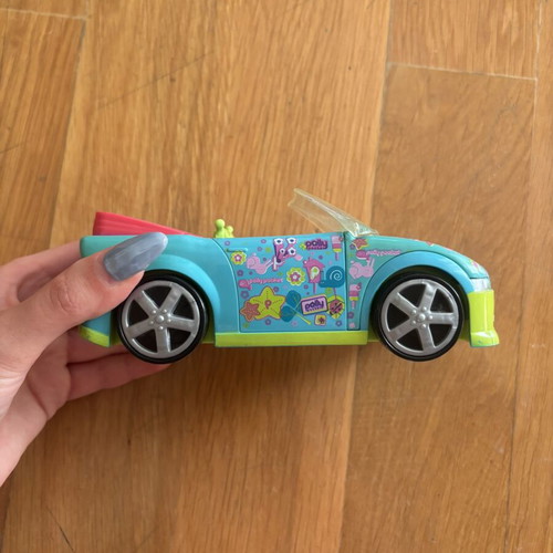 Vintage Polly Pocket set like new with car, dolls, and furniture