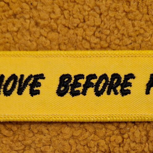 Remove Before Flight keychain new, yellow