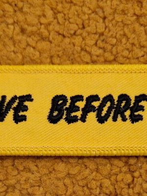 Remove Before Flight keychain new, yellow