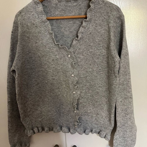 Women's gray cardigan with ruffles and pearl buttons new, one size