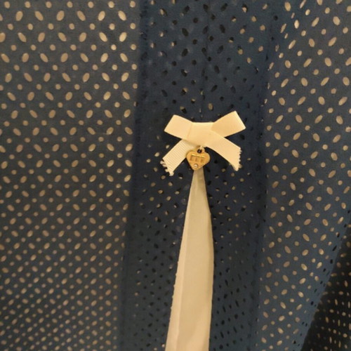 Matis top medium like new with lasercut design white and blue