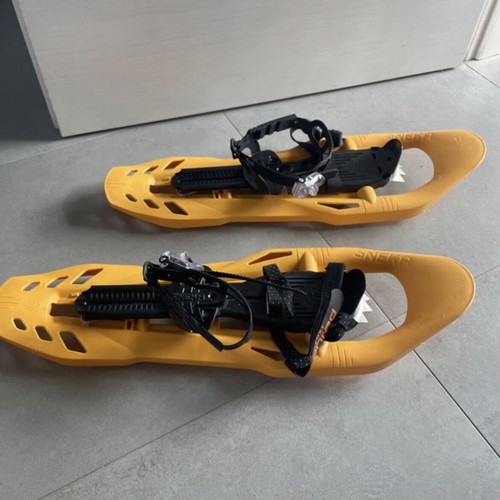 Sneka snowshoes used for hiking with metal crampons