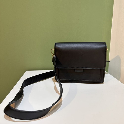 Black women's crossbody shoulder bag with gold details