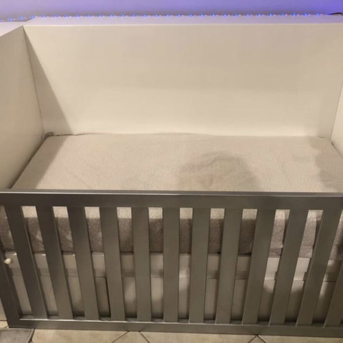 Cot that converts to bed with nightstand and desk used, with Greco strom mattress