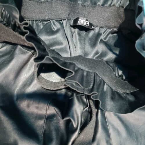 Black Anel shorts new with belt and leather texture, size M