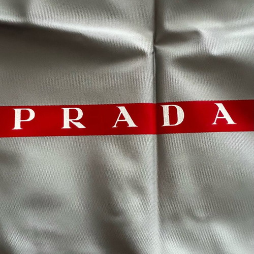 Prada case new, grey with red logo