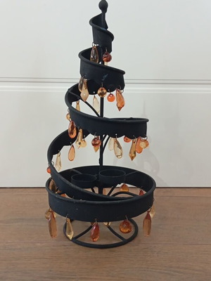 Black metal candle holder with 3 candle slots