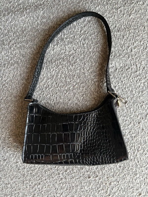Shoulder bag like new, black with embossed patterns
