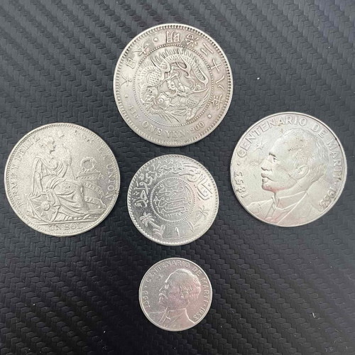 Silver coins from Cuba, Peru, Japan, Saudi Arabia