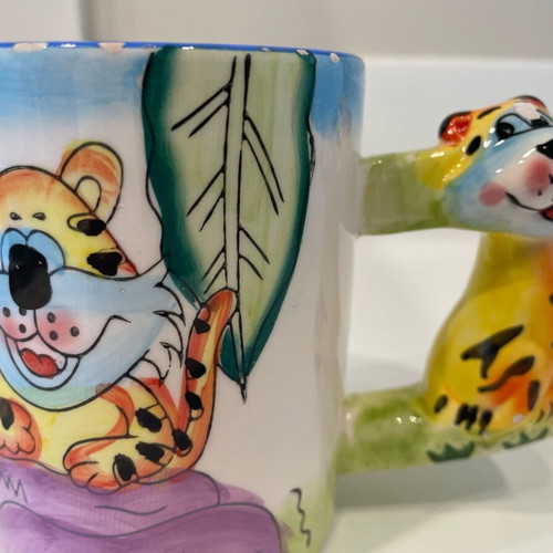 Tiger design mug used, small rim damages