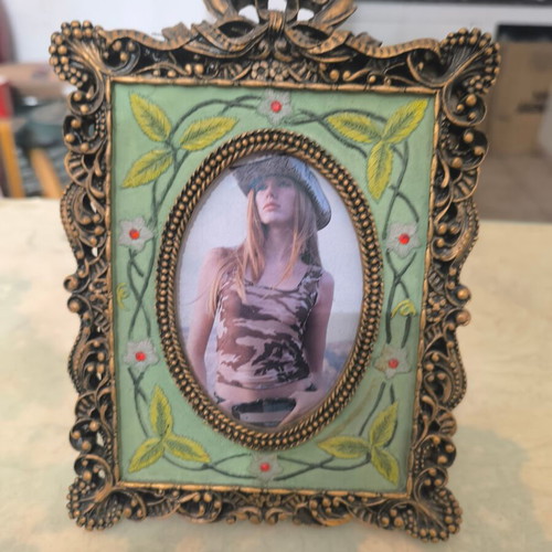 Vintage photo frame with oval opening and embossed design like new