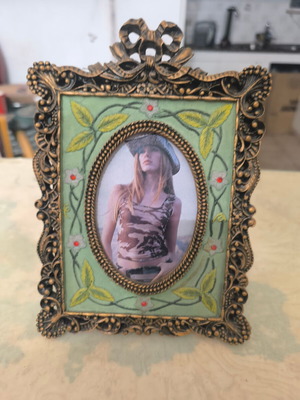 Vintage photo frame with oval opening and embossed design like new