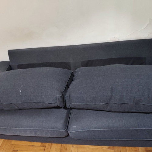 Two-seater fabric sofa used, dark gray color with visible marks