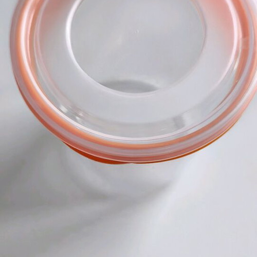 Storage container round like new, transparent with orange lid