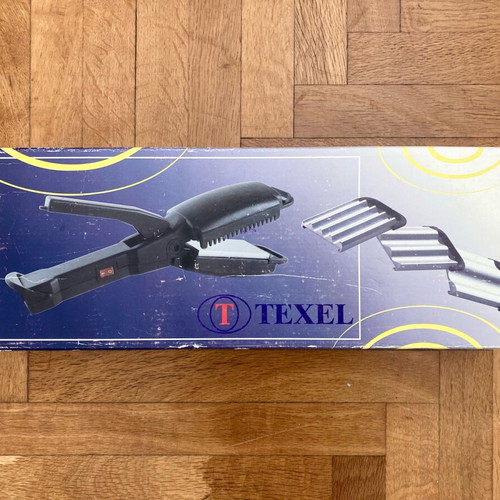 Hair iron used with 3 extra attachments for wavy hair