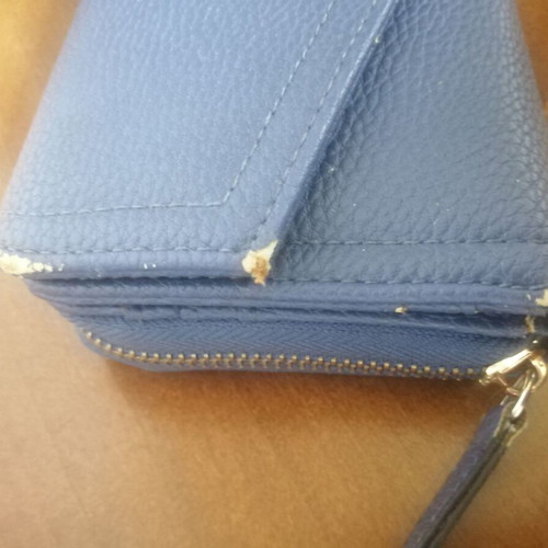 KEM wallet used, blue with multiple compartments