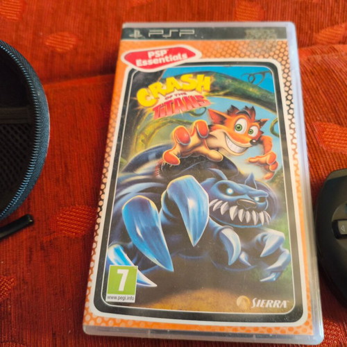 Sony PSP Street E1004 console with charger, case and 3 game cartridges