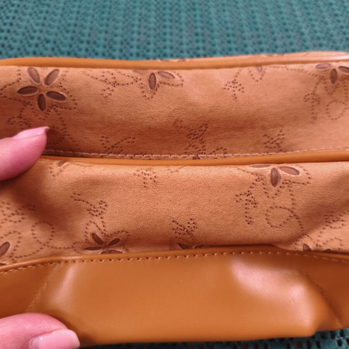 Women's cosmetic bag with floral punch-out design, synthetic leather, camel
