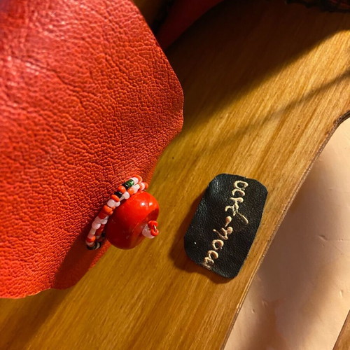 Wooden handmade bag with red leather stitched by hand