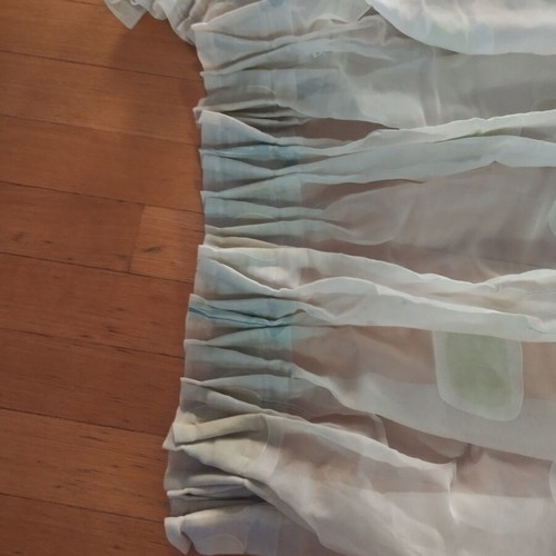 Semi-transparent curtain with soft floral patterns