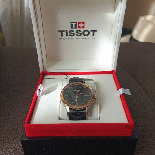 Tissot Classic Gent watch with 18k gold bezel, quartz, new