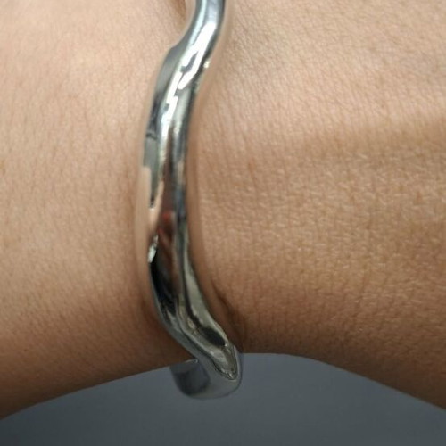 Silver metal cuff bracelet with minimal wave design