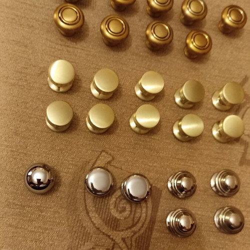 Handles and knobs for cabinets and drawers used, 24 pieces gold and silver
