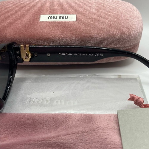 Miu Miu sunglasses new, black and gold for women