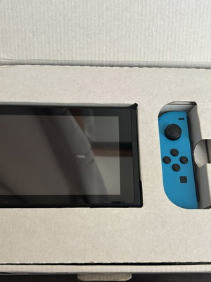 Nintendo Switch console with Joy-Con controllers and dock