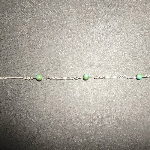 Silver bracelet with green beads used, needs repair