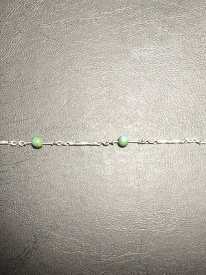 Silver bracelet with green beads used, needs repair