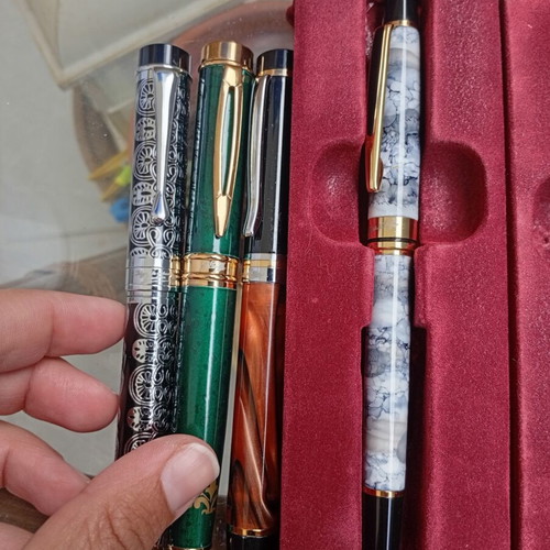 Pens in like-new condition with various designs