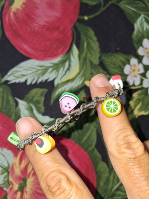Macrame bracelet with decorative fruit beads