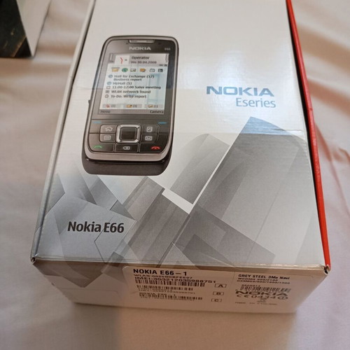 Nokia E66 retro slider phone used with original accessories
