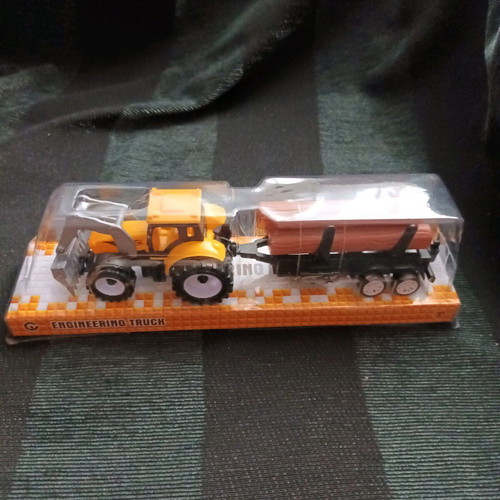 Tractor with trailer carrying logs new