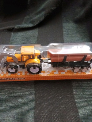 Tractor with trailer carrying logs new