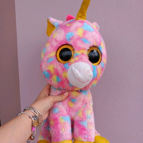 Plush unicorn used, very large, colorful with glass eyes