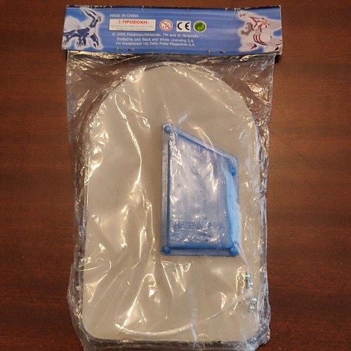 Pokemon set: vintage flipper, sleeves, embroidered badge