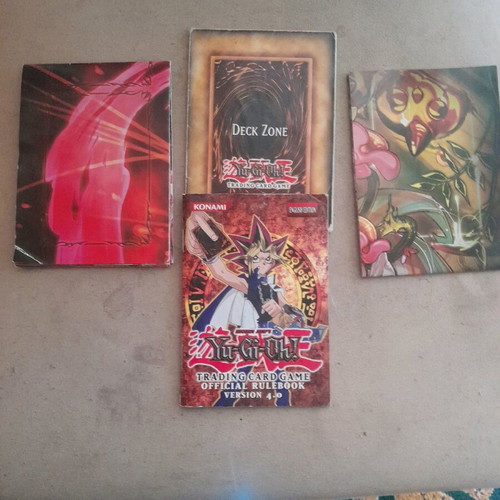 Yugioh official rulebook 4.0 and 3 used playmats Traptrix and Crimson King