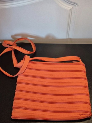 Alternative orange crossbody bag like new with zippers
