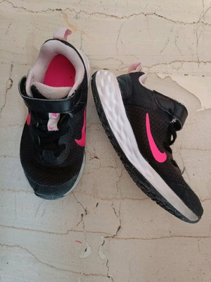 Nike Revolution kids athletic shoes used size 28 with pink interior