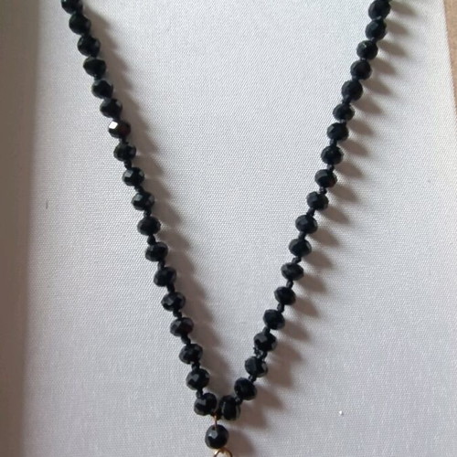 Long necklace like new with black stones and evil eye