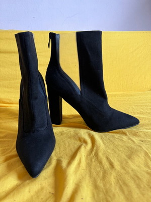 Heeled ankle boots unused, black with transparency