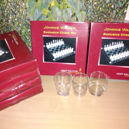 Johnnie Walker collectible set new with chess, whiskey glasses, and metal box