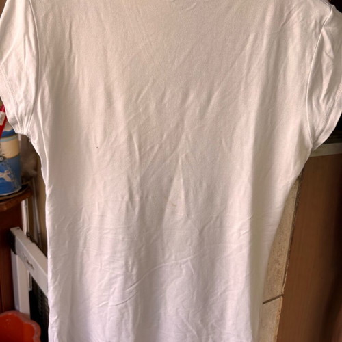 Women's white short-sleeve blouse with razor blade design, size S used