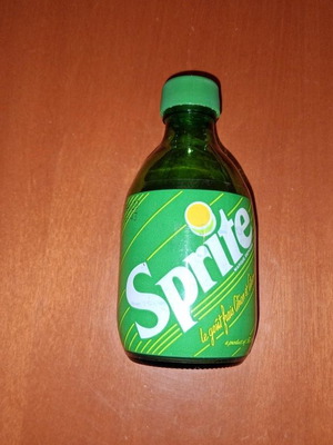 Sprite glass soda bottle used, empty, 1990s decade